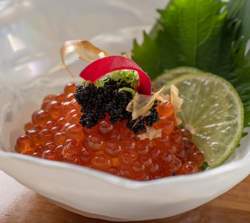 Salmon roe topped with caviar, served with lime and shiso leaf